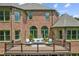 Brick home with a large deck and a green accent at 3215 Kylee Dawn Cir, Lawrenceville, GA 30045