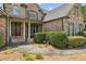 Inviting front porch with double doors and stone accents at 3215 Kylee Dawn Cir, Lawrenceville, GA 30045