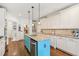 Open kitchen with blue island and stainless steel appliances at 3215 Kylee Dawn Cir, Lawrenceville, GA 30045