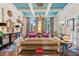 Bright living room features floral curtains and pink armchairs at 3215 Kylee Dawn Cir, Lawrenceville, GA 30045