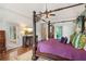 Main bedroom features a large four-poster bed and access to the backyard at 3215 Kylee Dawn Cir, Lawrenceville, GA 30045