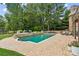 Large, inviting pool with stone coping and expansive patio at 3215 Kylee Dawn Cir, Lawrenceville, GA 30045
