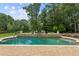 Inviting in-ground pool with brick patio and spacious seating area at 3215 Kylee Dawn Cir, Lawrenceville, GA 30045