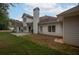 Rear view of house showing patio and lawn at 3020 Templeton Ln, Loganville, GA 30052