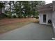 Small concrete patio adjacent to the house at 3020 Templeton Ln, Loganville, GA 30052