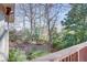 Deck overlooks a private wooded backyard with mature trees at 3736 Bloxham Ct, Atlanta, GA 30341