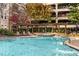 Relaxing pool area with pergola and surrounding landscaping at 1850 Cotillion Dr # 1425, Dunwoody, GA 30338