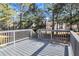 Back deck with gray railings and yard view at 2918 Fields Dr, Lithonia, GA 30038