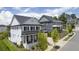 Two-story white brick home with black shutters and metal roof at 3065 Barnes Mill Ct, Roswell, GA 30075