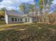 Spacious backyard with patio and wooded backdrop at 3233 Greenhill Dr, Villa Rica, GA 30180