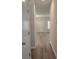 Bright hallway with light gray walls and wood-look flooring at 3233 Greenhill Dr, Villa Rica, GA 30180