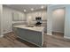 Open concept kitchen with a large island and gray cabinets at 3233 Greenhill Dr, Villa Rica, GA 30180