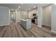 Modern kitchen with island, granite countertops, and stainless steel appliances at 3233 Greenhill Dr, Villa Rica, GA 30180