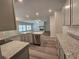 Open concept kitchen overlooking living room with fireplace at 3233 Greenhill Dr, Villa Rica, GA 30180