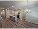 Open kitchen with island and stainless steel appliances at 3233 Greenhill Dr, Villa Rica, GA 30180