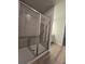 Spacious shower with tile surround and frameless glass door at 3233 Greenhill Dr, Villa Rica, GA 30180