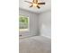 Well-lit bedroom featuring neutral walls and carpet at 223 Kathryn Ln, Marietta, GA 30066