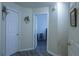 Bright hallway with doors leading to bedrooms at 6817 Mahonia Pl, Lithonia, GA 30038