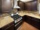 Modern kitchen with granite countertops and stainless steel appliances at 4814 Archer Pl, Acworth, GA 30101