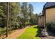 Landscaped backyard with mature trees and lawn at 6055 Tattnall Overlook, Acworth, GA 30101