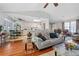 Open living room features hardwood floors, a neutral color palette, and access to the kitchen at 101 Shannon Chase Ln, Fairburn, GA 30213