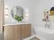 Elegant bathroom with freestanding tub, double vanity, and marble countertops at 11273 Serenbe Ln, Chattahoochee Hills, GA 30268