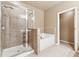 Main bathroom with shower and garden tub at 2368 Harshaw Ave # 166, Lawrenceville, GA 30043