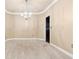 Formal dining room with neutral carpeting and chandelier at 2368 Harshaw Ave # 166, Lawrenceville, GA 30043