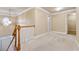 Upstairs hallway with carpet and access to bedrooms at 2368 Harshaw Ave # 166, Lawrenceville, GA 30043