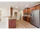 Kitchen with wood cabinets, granite counters, and stainless steel appliances at 2368 Harshaw Ave # 166, Lawrenceville, GA 30043