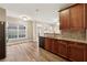Eat-in kitchen with granite countertops and wood cabinets at 2368 Harshaw Ave # 166, Lawrenceville, GA 30043