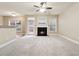 Spacious living room with a fireplace and neutral carpeting at 2368 Harshaw Ave # 166, Lawrenceville, GA 30043