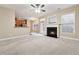 Living room featuring a fireplace and access to the backyard at 2368 Harshaw Ave # 166, Lawrenceville, GA 30043