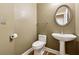 Small powder room with pedestal sink and toilet at 2368 Harshaw Ave # 166, Lawrenceville, GA 30043
