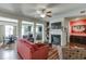 Spacious living room featuring a fireplace and hardwood floors at 3393 Sardis Bend Dr, Buford, GA 30519