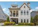 Two-story craftsman home with gray siding, shutters, and a covered porch at 5499 Vineyard Park Trl, Norcross, GA 30071