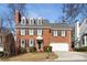 Brick two-story house with a white garage door and manicured lawn at 1138 Haven Glen Ne Ln, Brookhaven, GA 30319