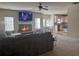 Open concept living room with kitchen view and fireplace at 211 Alderleaf Ct, Mcdonough, GA 30252