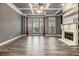 Living area with hardwood floors, fireplace and large windows at 2063 Callaway Nw Ct, Atlanta, GA 30318