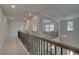 Spacious upper hall with wrought iron railings and carpet at 62 Homesite Cooper W Cv, Fayetteville, GA 30215