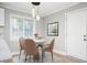 Charming dining area with modern light fixture and hardwood floors at 2198 Star Mist Sw Dr, Atlanta, GA 30311