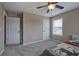 Charming bedroom with ceiling fan, window, and carpeted floor at 33 Riverview Trl, Euharlee, GA 30145