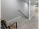 Spacious basement hallway with gray carpeting at 530 Penny Ln, Loganville, GA 30052