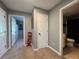 Well-lit hallway with access to bedrooms and bathroom at 5106 Thorin Oak Cir, Sugar Hill, GA 30518