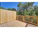 Private deck with wood railings and a fenced yard at 7012 Fringe Flower Dr # 87, Austell, GA 30168