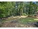 Wooded backyard with a mostly flat yard at 4218 Tara Dr, Forest Park, GA 30297