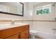 Clean bathroom with a bathtub and updated vanity at 4218 Tara Dr, Forest Park, GA 30297