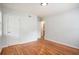 Spacious bedroom featuring hardwood floors and built-in closet at 4218 Tara Dr, Forest Park, GA 30297