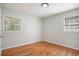Bright bedroom with hardwood floors and two windows at 4218 Tara Dr, Forest Park, GA 30297