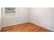Hardwood floors and neutral walls in this cozy bedroom at 4218 Tara Dr, Forest Park, GA 30297